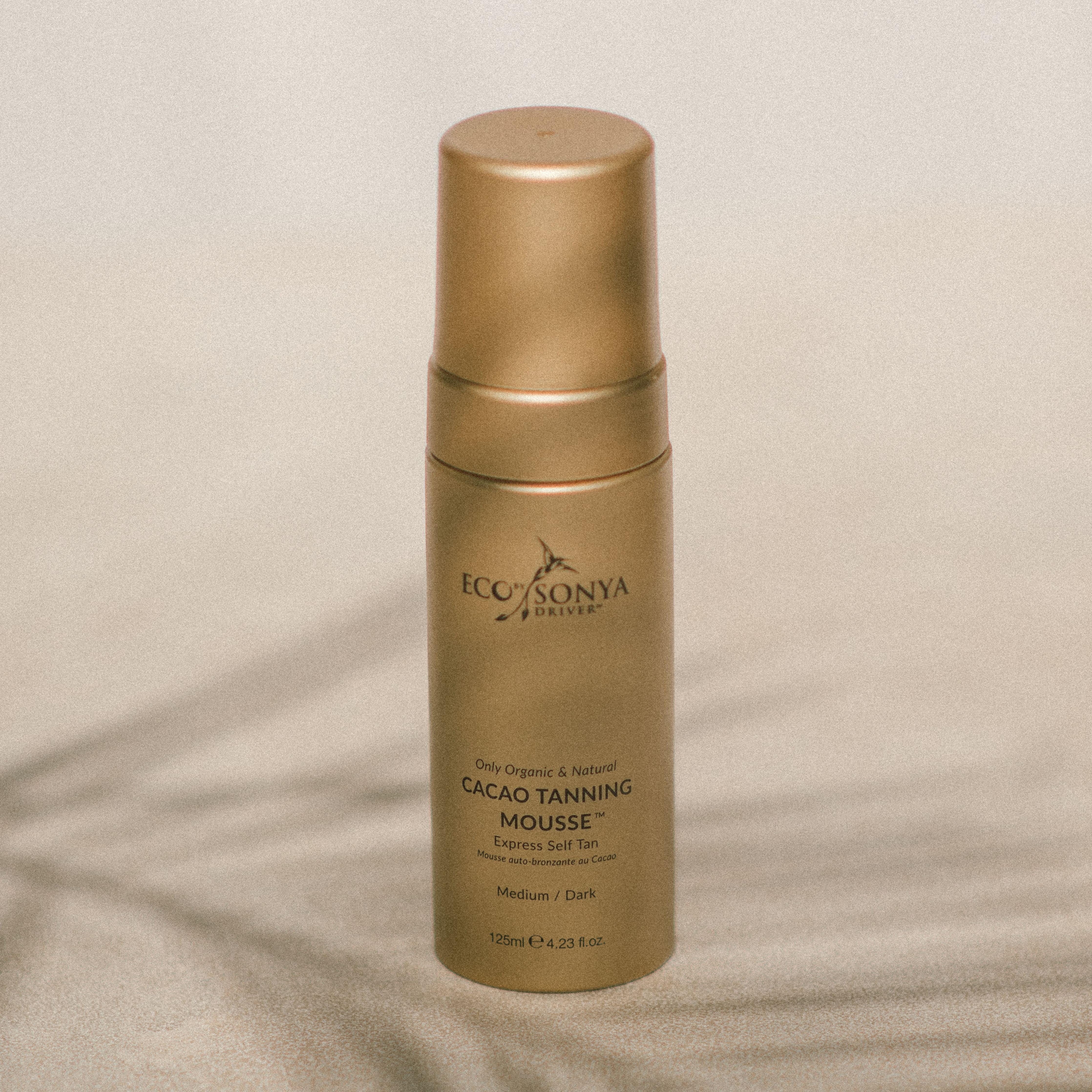 Self-tanning and firming cocoa body mousse
